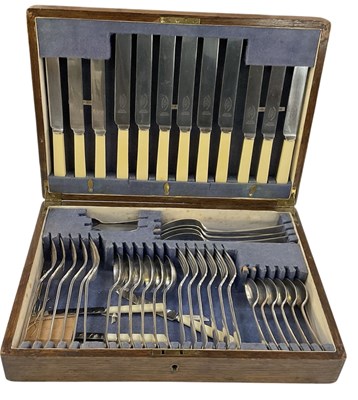 Lot 1088 - An early 20th century oak cased six setting...