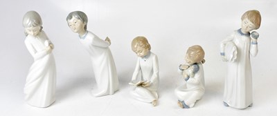 Lot 129 - NAO; five figures of children in nightshirts,...