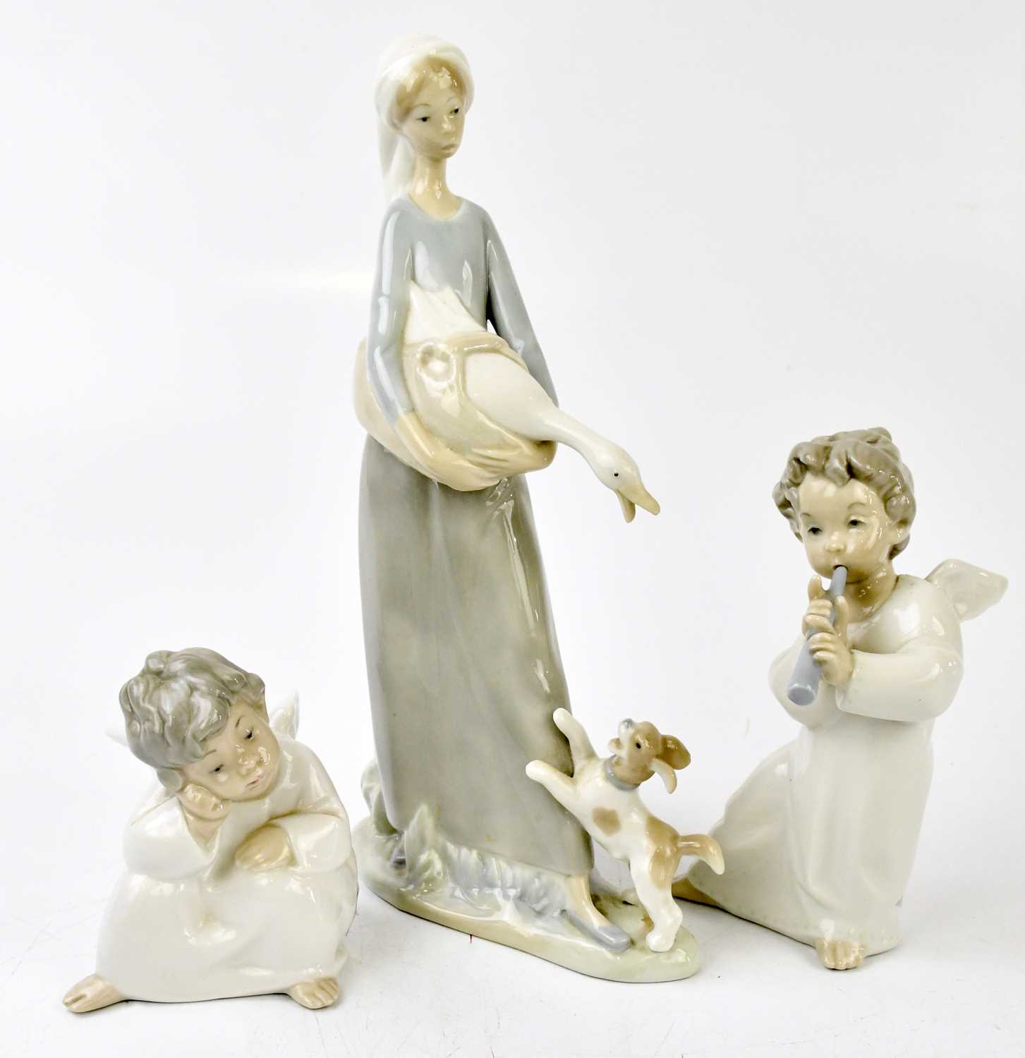 Lot 628 - LLADRO; three figures, including two cherubs,...