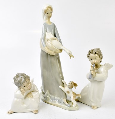 Lot 628 - LLADRO; three figures, including two cherubs,...