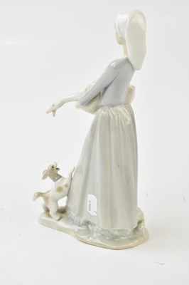 Lot 628 - LLADRO; three figures, including two cherubs,...