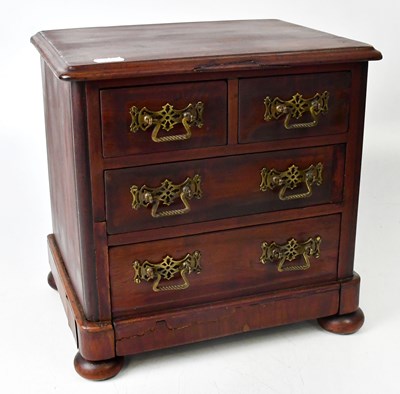 Lot 266 - A mahogany apprentice made miniature chest of...