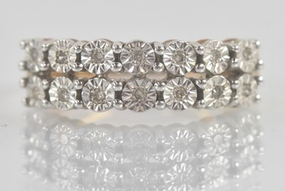 Lot 1254 - A 9ct yellow gold diamond set half eternity...