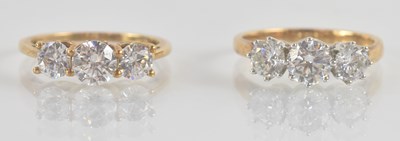 Lot 1235 - Two 9ct yellow gold white stone rings, both...
