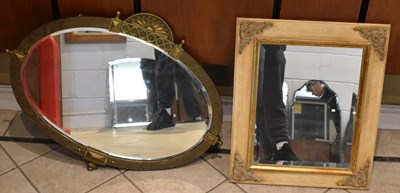 Lot 98 - A modern oval brass wall mirror, and a modern...