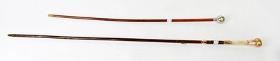 Lot 311 - A swagger stick with white metal finial...