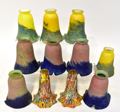 Lot 104 - A set of four yellow and mottled green glass...