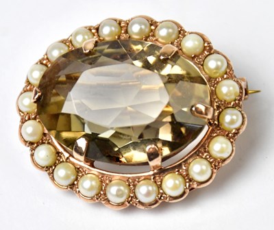 Lot 1223 - A yellow metal brooch set with an oval smoky...