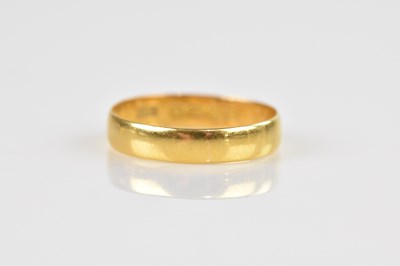 Lot 2422 - A 22ct yellow gold wedding band, size P 1/2,...