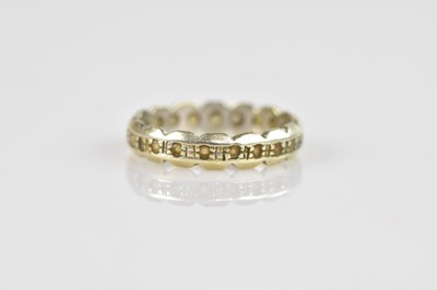 Lot 2536 - A white metal eternity ring, indistinctly...