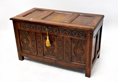 Lot 64 - A Georgian oak three panelled coffer with...