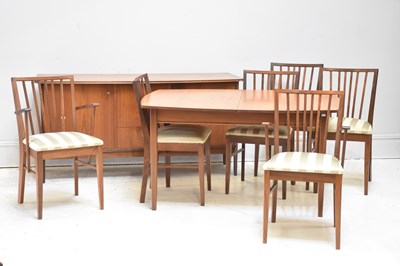 Lot 49 - A mid century teak dining suite comprising...