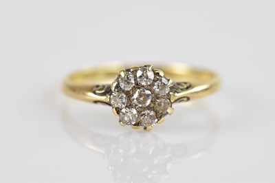 Lot 2426 - A Victorian yellow metal diamond set cluster...