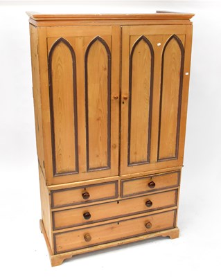 Lot 11 - A pine linen press converted to a wardrobe,...