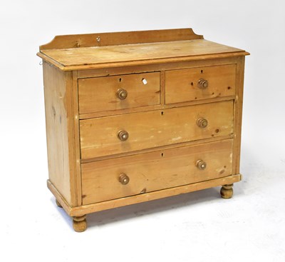 Lot 19 - An early 20th century pine chest of two short...