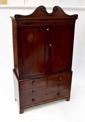 Lot 8 - A Victorian mahogany linen press, the arched...