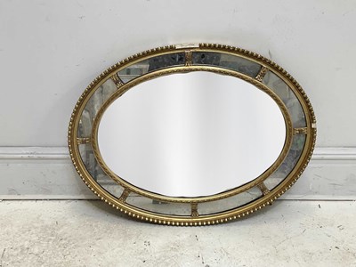 Lot 33 - A 19th century gilt framed oval wall mirror,...
