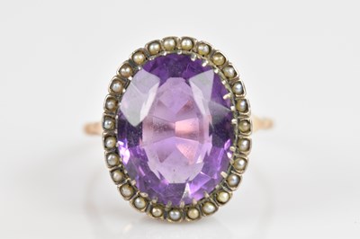 Lot 2423 - A yellow metal seed pearl and amethyst set...