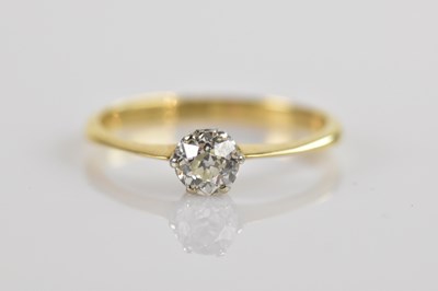 Lot 2424 - An 18ct yellow gold diamond set solitaire ring,...
