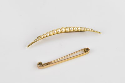 Lot 1319 - A Victorian yellow metal crescent brooch, set...