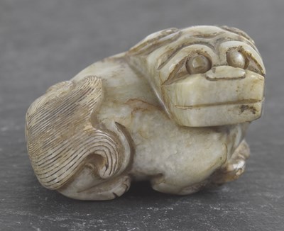 Lot 1008 - A green apple jade Chinese Ming dynasty kylin,...