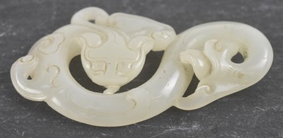 Lot 1004 - An 18th/19th century Chinese pierced pale jade...