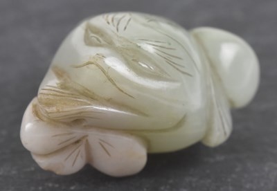 Lot 1014 - An 18th/19th century Chinese apple jade carved...