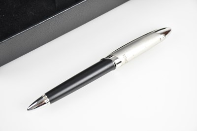 Lot 110 - GIANNI VERSACE; a black and chrome ballpoint...