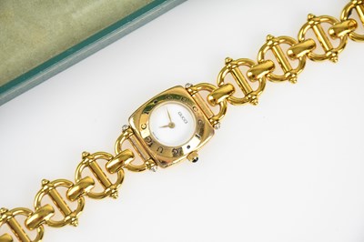 Lot 204 - GUCCI; a gold tone 6400L Horsebit Swiss quartz...