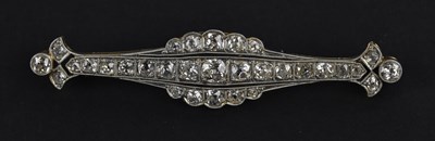Lot 1260 - A yellow and white metal diamond set bar...