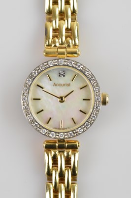 Lot 509 - ACCURIST; a lady's 9ct gold cased wristwatch,...