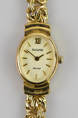 Lot 510 - ACCURIST; a lady's 9ct gold cased wristwatch,...