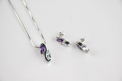 Lot 2104 - A white metal pendant set with amethyst...