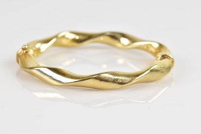 Lot 1145 - An Italian yellow metal twisted hinged snap...