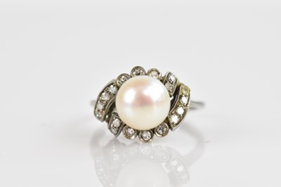 Lot 2478 - A white metal diamond and pearl set dress ring,...