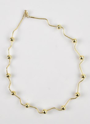 Lot 2134 - An unusual yellow metal expandable necklace...