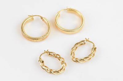 Lot 1413 - A pair of 9ct yellow gold hoop earrings with...