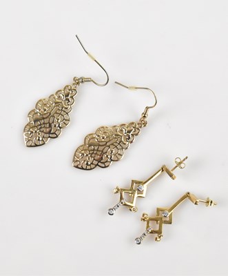 Lot 1402 - A pair of 9ct yellow gold drop earrings, set...