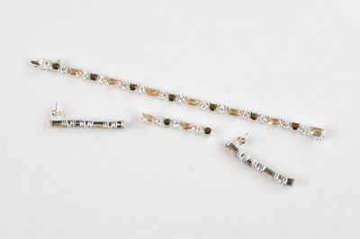 Lot 1020 - A contemporary sterling silver tennis bracelet,...
