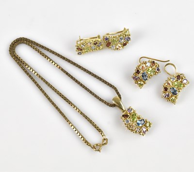 Lot 2068 - A yellow metal multigem set pendant, suspended...