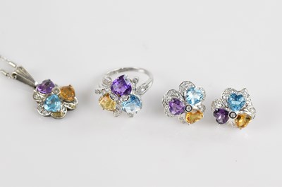 Lot 2420 - A 9ct white gold four piece suite of jewellery...