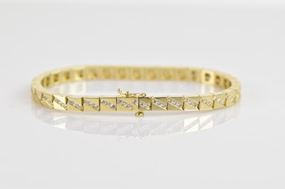 Lot 1124 - A yellow metal tennis bracelet, stamped '14k',...