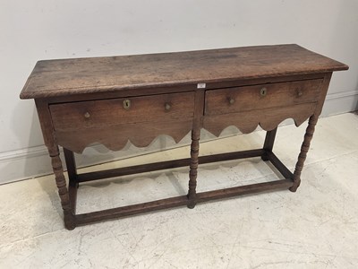 Lot 61 - An 18th century oak dresser base with two...