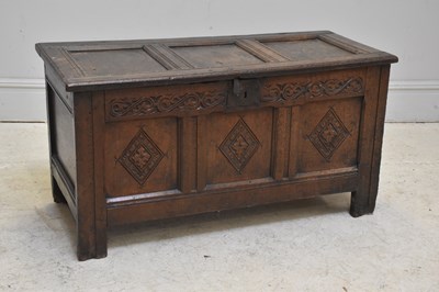 Lot 74 - An 18th century carved and panelled oak coffer,...