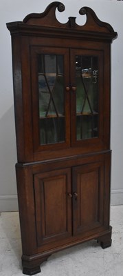 Lot 75 - An 18th century oak freestanding corner...