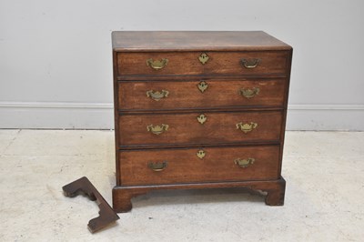Lot 80 - A George III oak chest of four drawers, on...