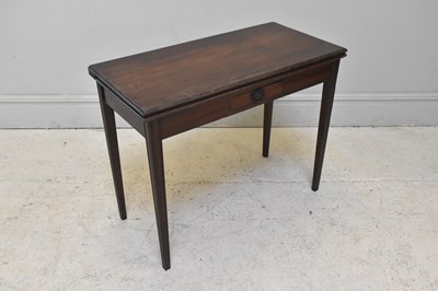 Lot 298 - A Georgian mahogany foldover tea table with...