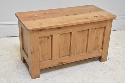 Lot 101 - A vintage pine blanket chest with panelled...