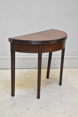 Lot 301 - A George III mahogany demi-lune tea table, on...