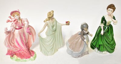 Lot 136 - Four ceramic figures of ladies, comprising...